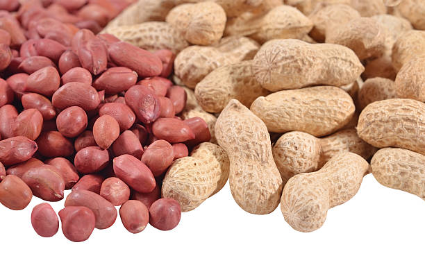 istock Heap of peanuts on a white 464638988
