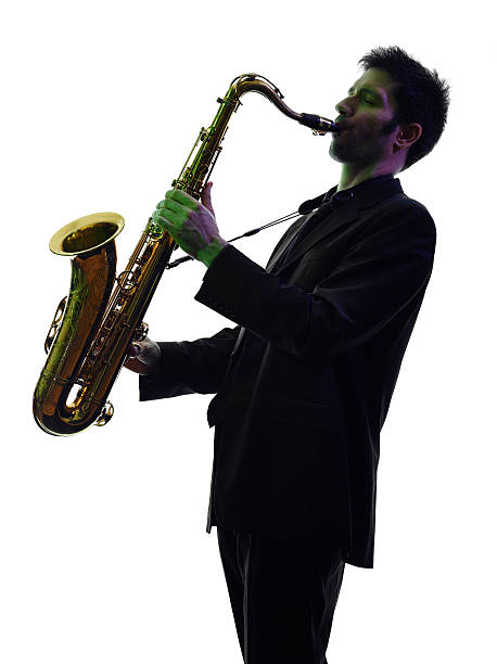 istock man saxophonist playing saxophone player  silhouette 464642698