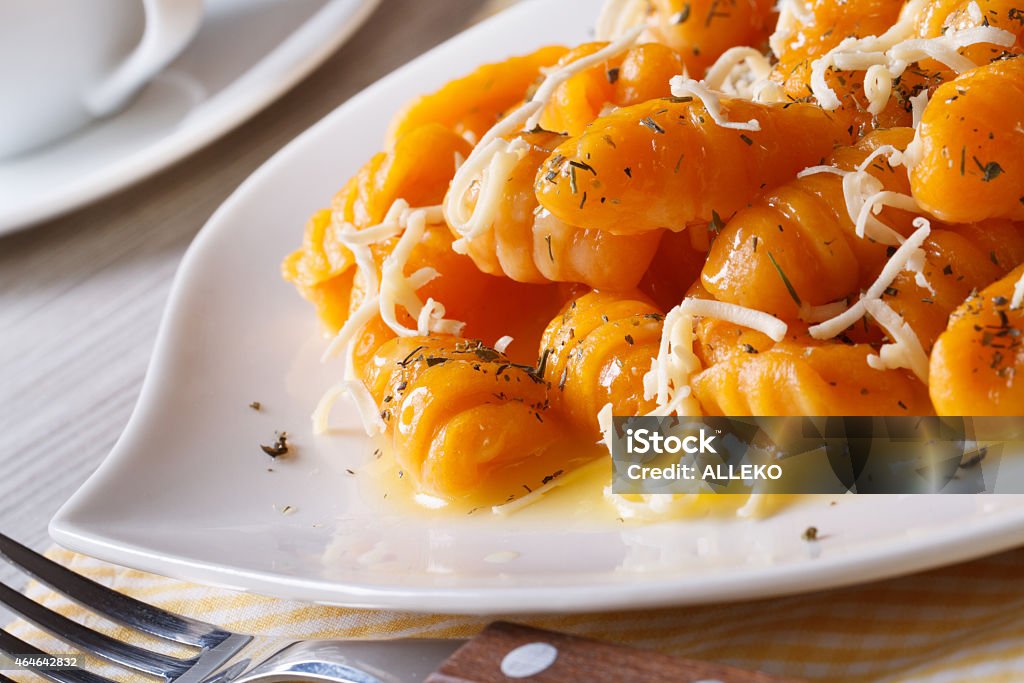 Pumpkin gnocchi with cheese and butter. Horizontal Pumpkin gnocchi with cheese and butter on a plate closeup. horizontal 2015 Stock Photo