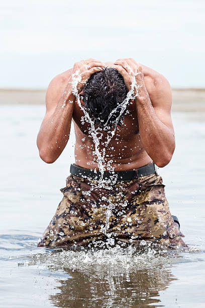 istock Close up Muscled Army Bathing at the Sea 464644158