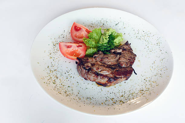istock Fresh cooked steak with sauce and onion 464644436