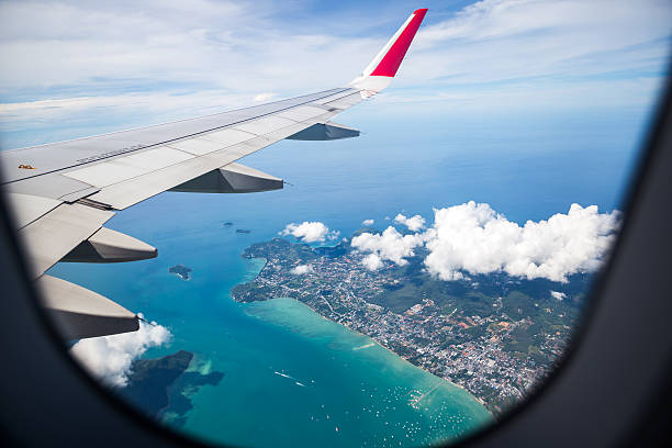 The view from an airplane window overlooking the ocean