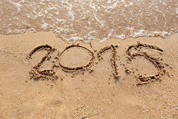 istock Beaches waves and text 2015 drawn in the sand. 464645918