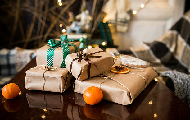 istock 4 small gifts wrapped in brown paper with ribbon bows 464646954