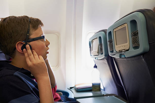 istock Teenager on a plane 464649241