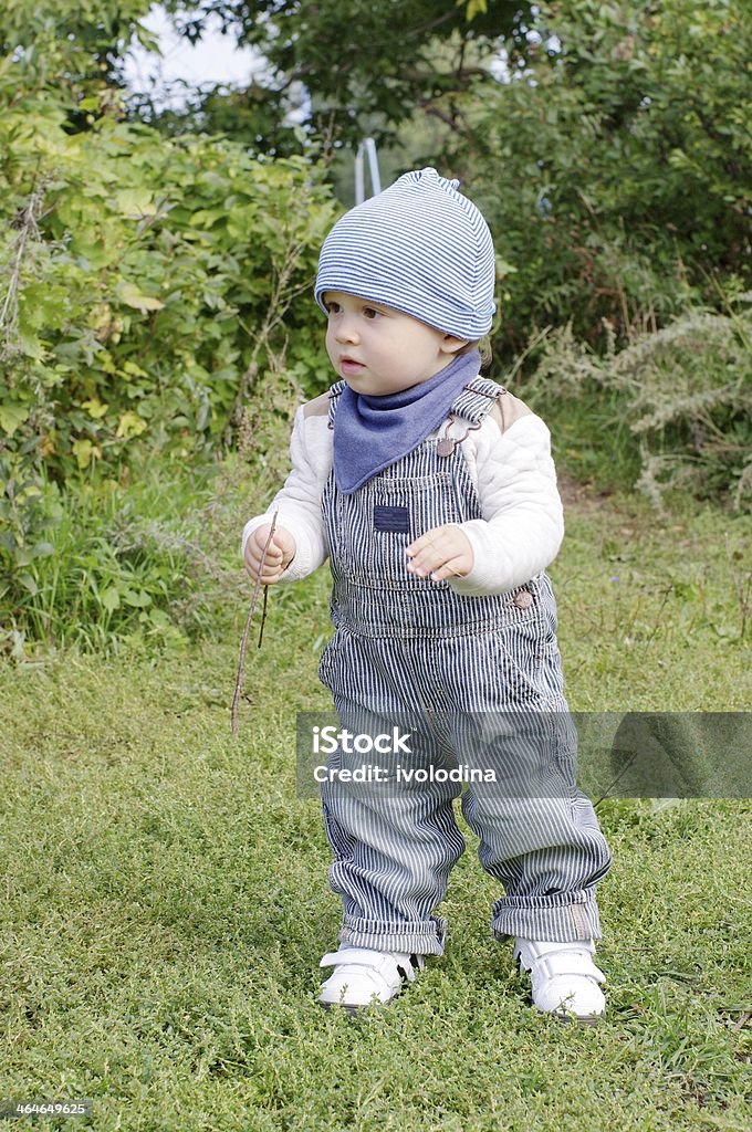 baby walking in park nice baby age of 1 year walking in park 12-23 Months Stock Photo