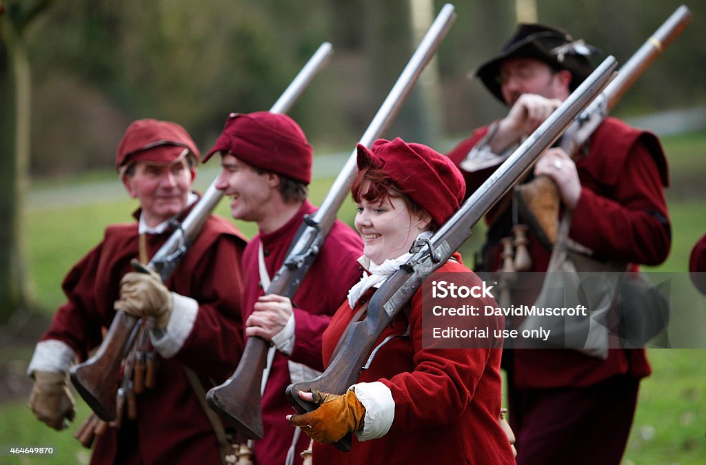 Soldiers reenact the Battle of Nantwich English Civil War nantwich,united kingdom- January 21, 2012: Holly Holy Day,recreating the Battl of Nantwich. Enthusiasts dressed in period costume reenact the Battle of Nantwich during the English Civil War.This historic event held in Nantwich,Cheshire, UK, every January 2015 Stock Photo