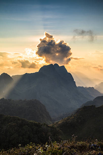 istock beam of light on the mountain peak 464650126
