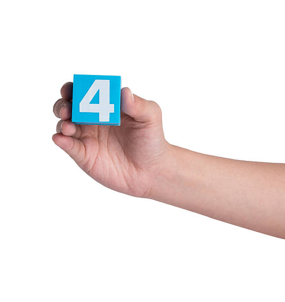 istock Hand holind colorful plastic numbers on a white background 464653254