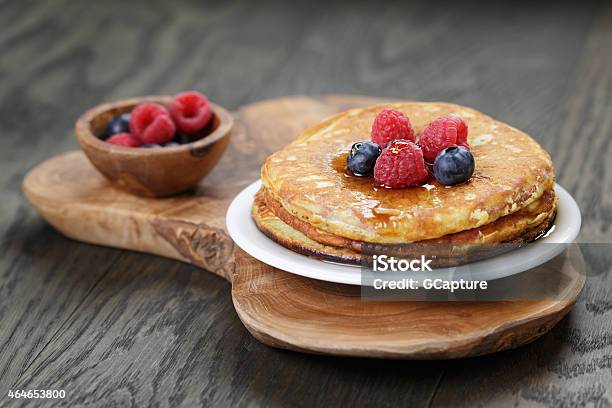 Pancakes Pictures With A Topping Of Berries And Maple Syrup Stock Photo - Download Image Now