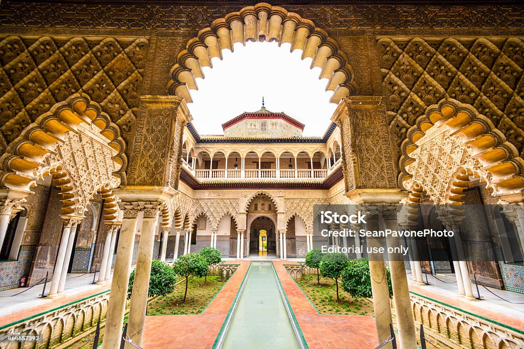Alcazar of Seville Seville, Spain - November 7, 2014: The Royal Alcazar of Seville at the Courtyard of the Maidens. It is the oldest royal palace still in use in Europe. Seville Stock Photo