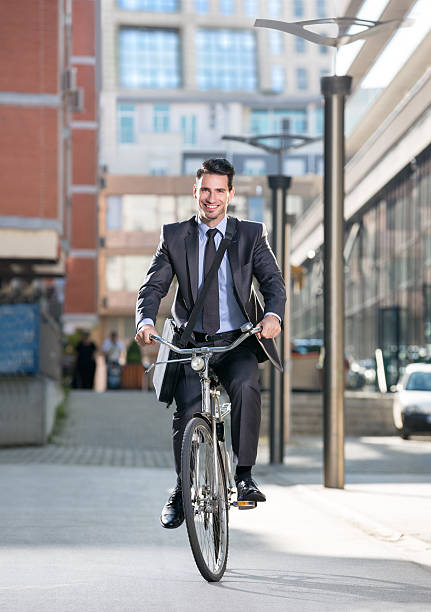 istock Man on a bicycle with modern city background 464657630