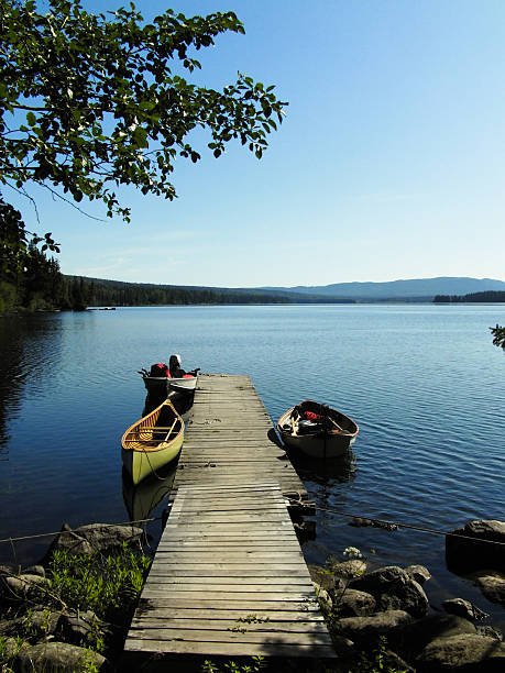 istock Empty Boats at a Lakeshore Dock 464659007