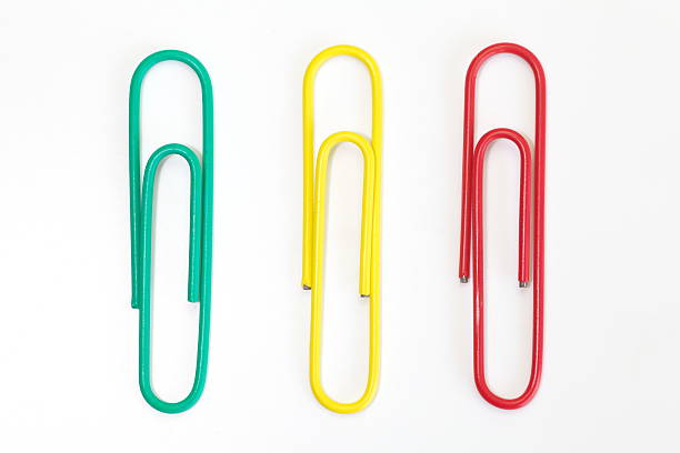 istock Color metal paper clip isolated on white background 464663522