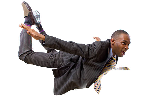 Flying Businessman in Flight or Falling on a White Background