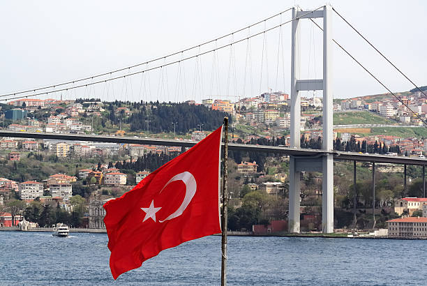 istock turkish flag and the bosphorus bridge in istanbul turkey 464666207
