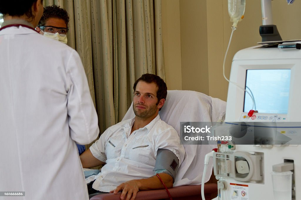 Doctor, nurse and patient reviewing care Renal dialysis patient has care review with doctor and nurse Dialysis Stock Photo