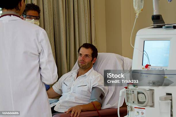 Doctor Nurse And Patient Reviewing Care Stock Photo - Download Image Now - Dialysis, Patient, Hemodialysis