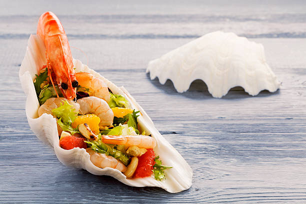istock Shrimp salad with grapefruit, orange and roasted peanuts. - Serv 464667384