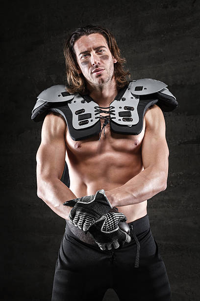 Bare chested american football player Bare chested american football player Chest Protector stock pictures, royalty-free photos & images