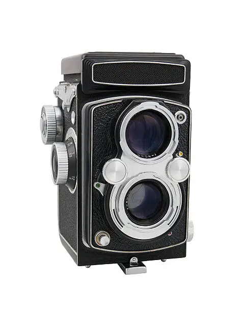 Old style twin-lens reflex camera, isolated with clipping path.
