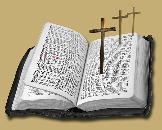 istock Open Bible with the the Crucifix and two crosses 464672480