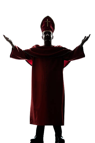 istock man cardinal bishop silhouette saluting blessing 464676508