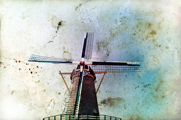 istock Vintage photo dutch windmill in front of blue sky 464679103