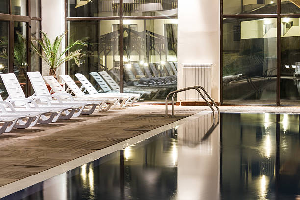 istock Luxury swimming pool in a modern hotel 464683121