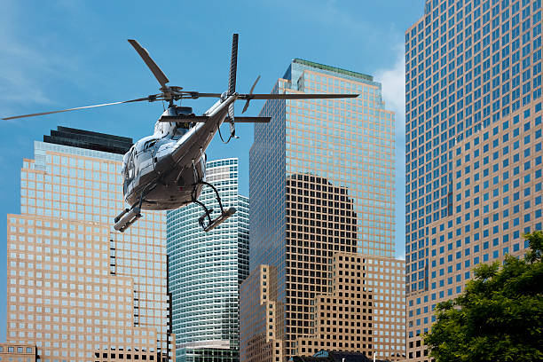 Helicopter flying between the scyscraper of manhattan south