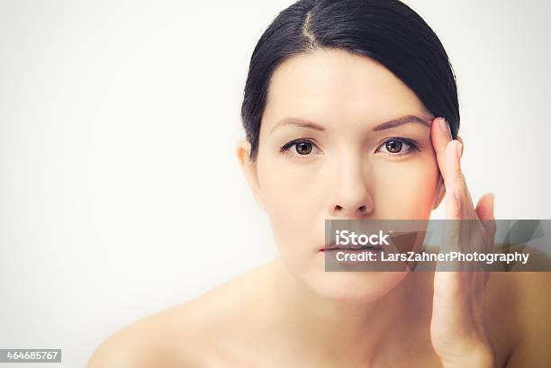 Young Woman Observing Facial Wrinkles Stock Photo - Download Image Now - Human Face, Adult, Aging Process