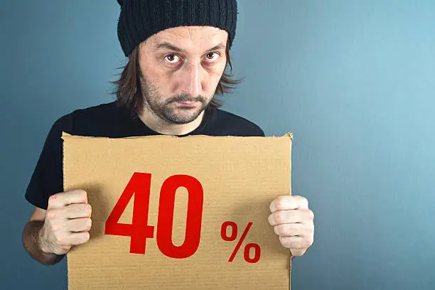 Photo of Man holding cardboard paper with sales discount price