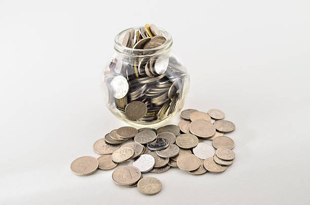 istock Malaysian Coin in glass container. 464687914