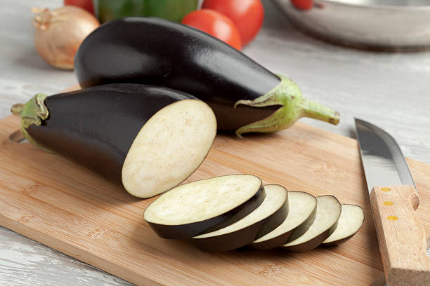 istock Fresh purple eggplants and slices 464688314