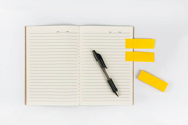 Open notebook with post it stock photo