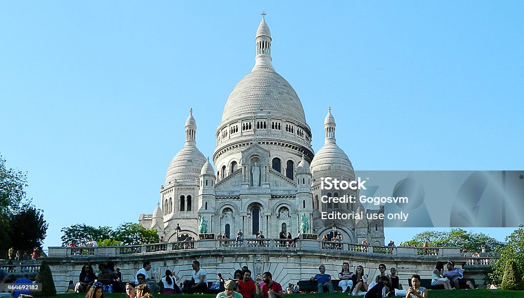 Coronation Heart Paris, France - June 5, 2013: There are some tourists with the view of Basilique Du Sacre Coeur in a sunny day. Basilique Du Sacre Coeur is one of the famous landmark and many tourists visit it in Paris. 2015 Stock Photo