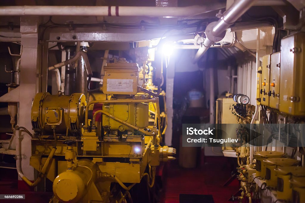 Engine room on a cargo boat ship with gears Engine room on a cargo boat ship 2015 Stock Photo