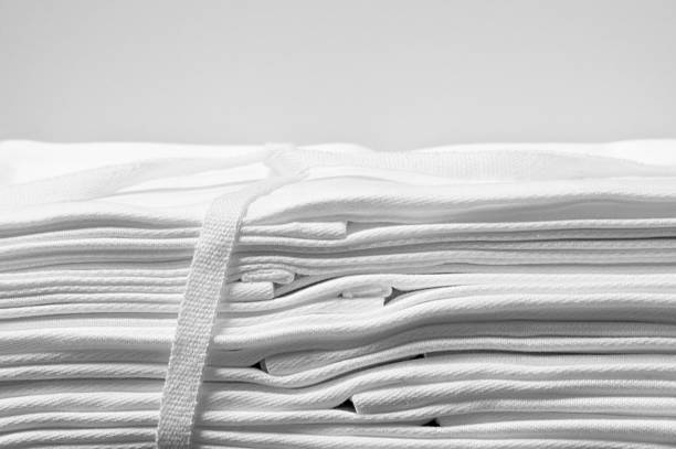 istock laced bundle of white damask cloth napkins 464694866