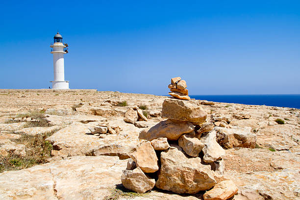 istock Barbaria formentera Lighthouse make a wish stones 464695660