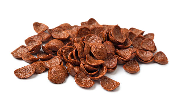 istock Pile of chocolate breakfast flakes on white background 464696086