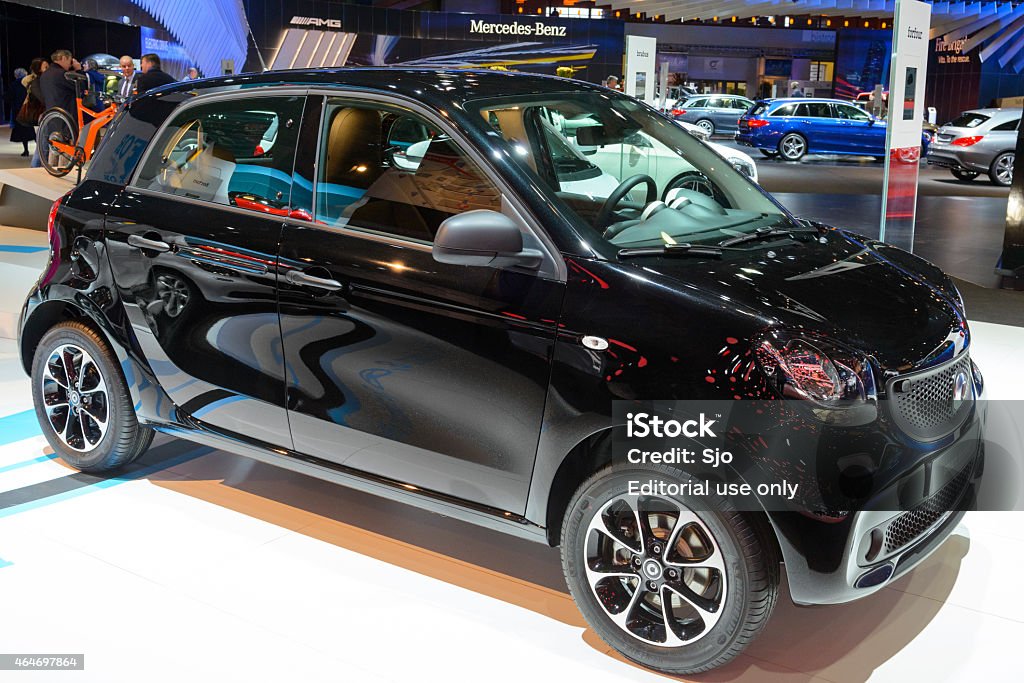 Smart ForFour compact car Brussels, Belgium - January 15, 2015: Smart ForFour compact car on display during the 2015 Brussels motor show. People in the background are looking at the cars. 2015 Stock Photo
