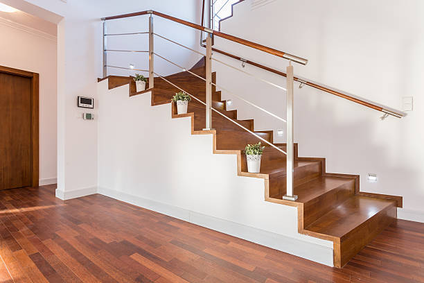istock Flowerpots situated on wooden stairs 464700578