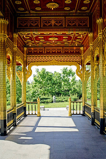 Madison, WI, USA - June 9, 2007: Inside the golden Thai Pavilion with a view of the ornate gilded ceiling and walls at the Olbrich Botanical Gardens in Madison Wisconsin. The pavilion was a gift to the University of Wisconsin-Madison from the Thai Government and the Thai Chapter of the Wisconsin Alumni Association