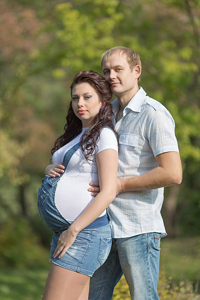 istock Attractive family in the park 464703799
