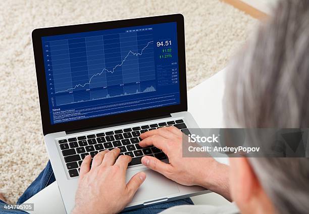 Mature Man Using Laptop Stock Photo - Download Image Now - Stock Market and Exchange, Stock Certificate, Laptop