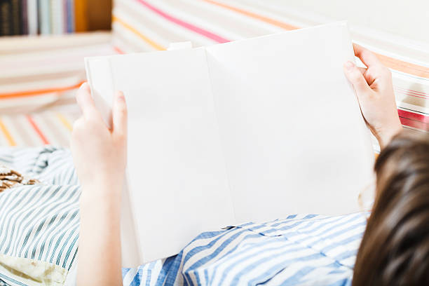 istock girl read book with blank pages 464705398