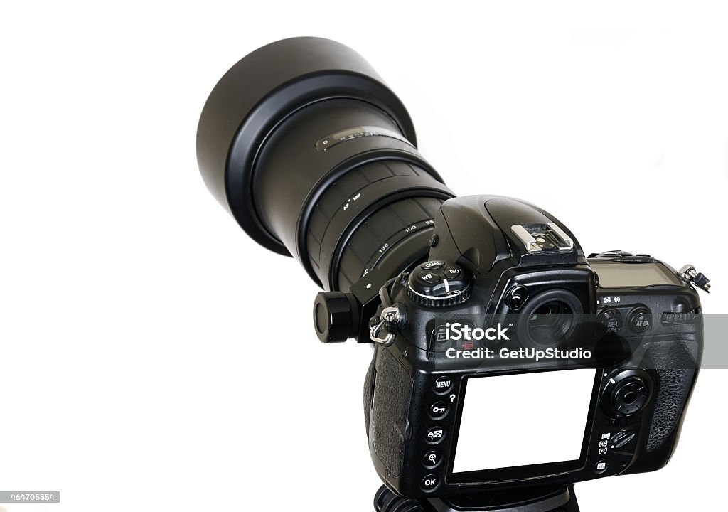 Professional digital SLR camera with zoom tele photo lens isolated Digital professional camera on triopod with blank screen isolated on white background 2015 Stock Photo