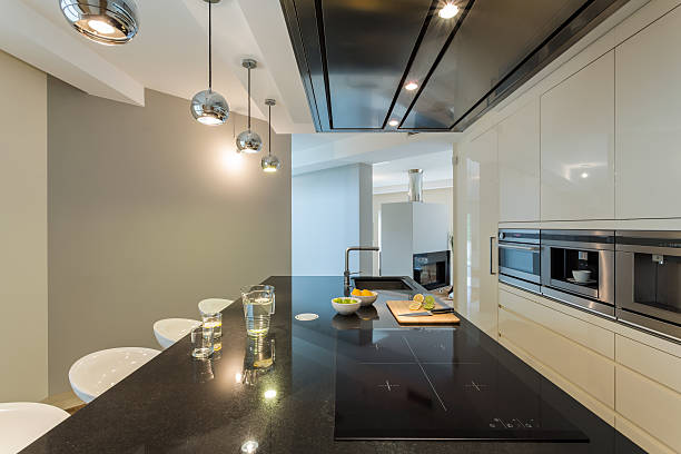 istock Modern-style kitchen in black and white with appliances 464705920