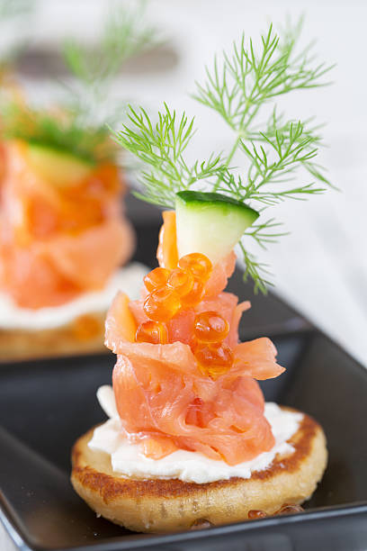 istock Smoked salmon and sour cream appetiser, garnished with dill 464712733