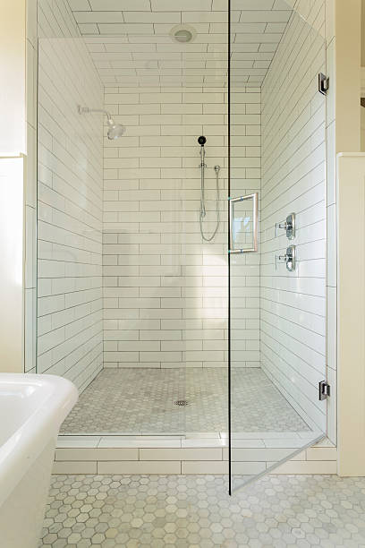 istock Tile shower with glass door in maser bathroom 464713565